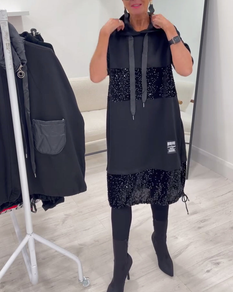 Witamy w modnej sukience z dekoltem i patchworkiem 